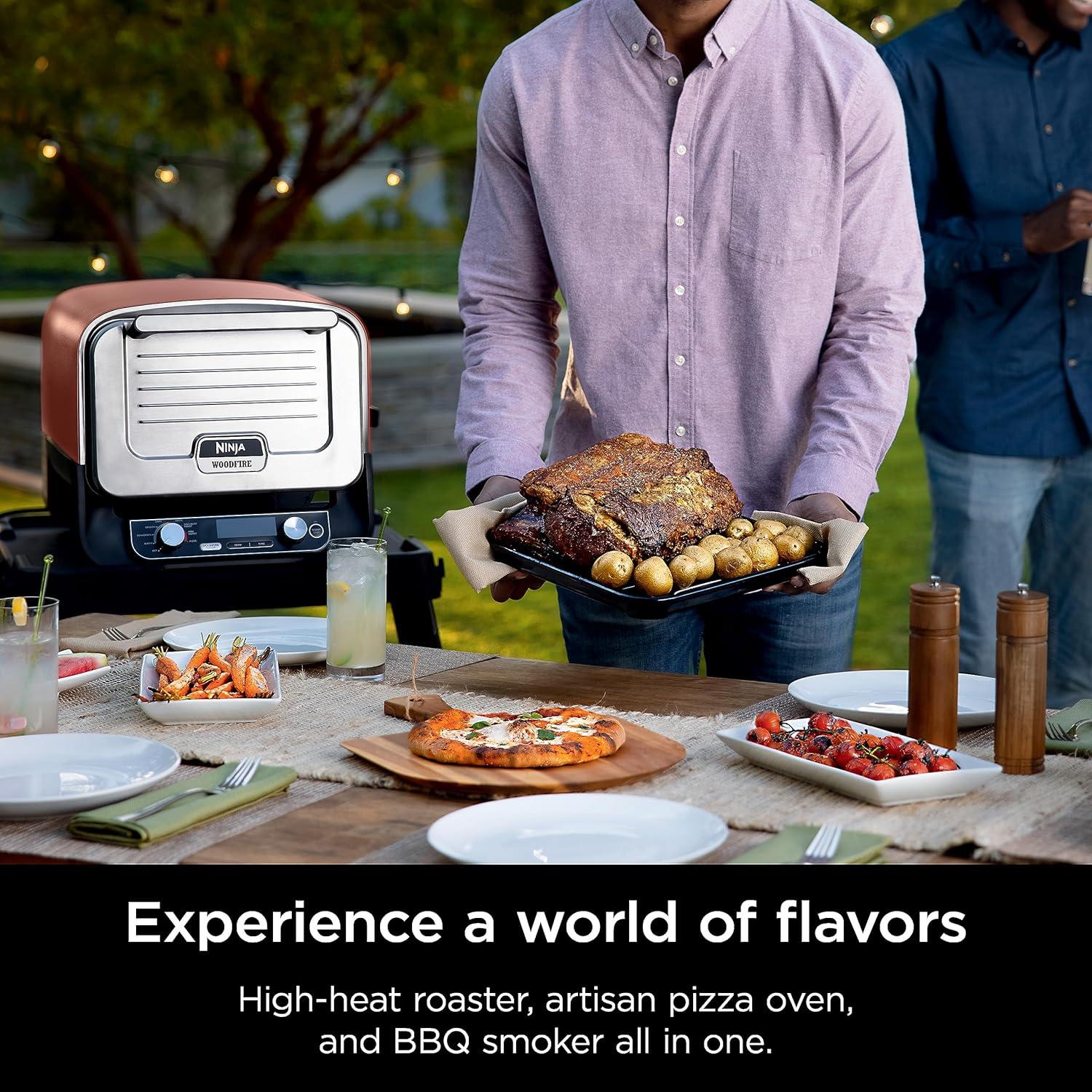 imageNinja Woodfire Outdoor Pizza Oven 8in1 Portable Electric Roaster Oven Heats up to 700F 5 Artisan Pizza Settings Integrated BBQ Smoker Box Includes Flavored Wood Pellets Terracotta RedPizza Oven Smoker